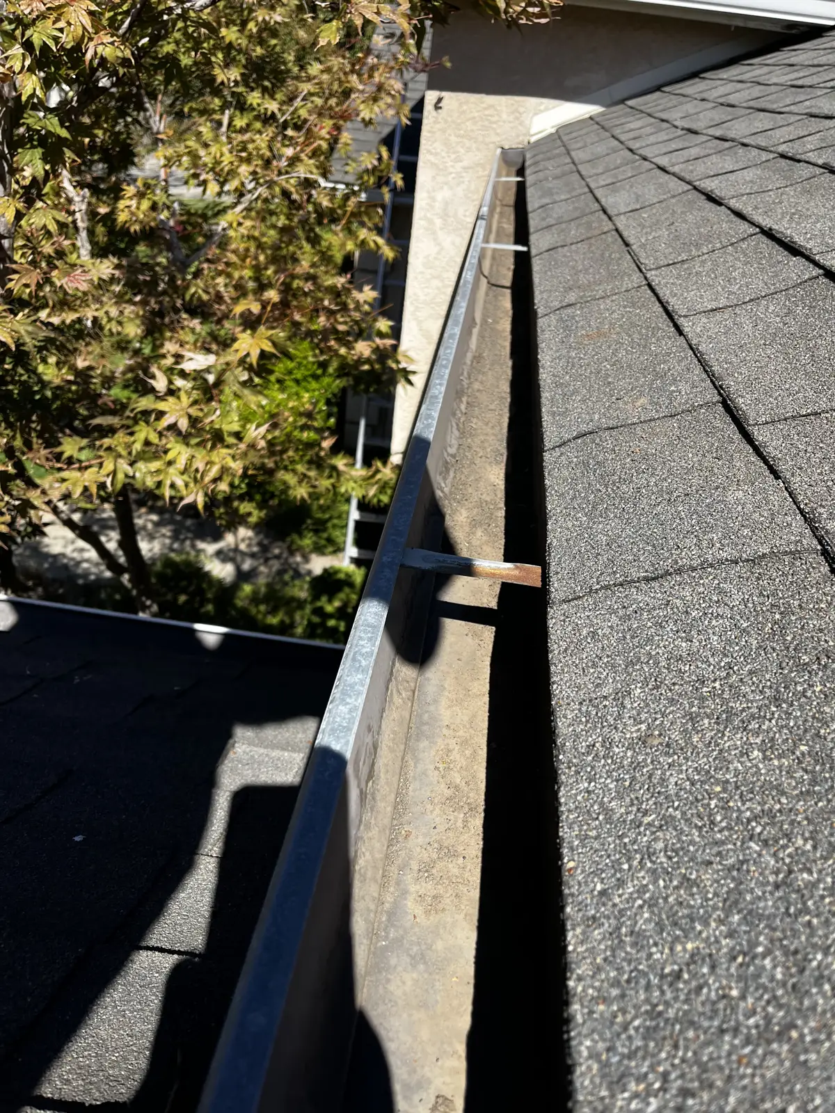 After: the same gutter cleaned out and flowing