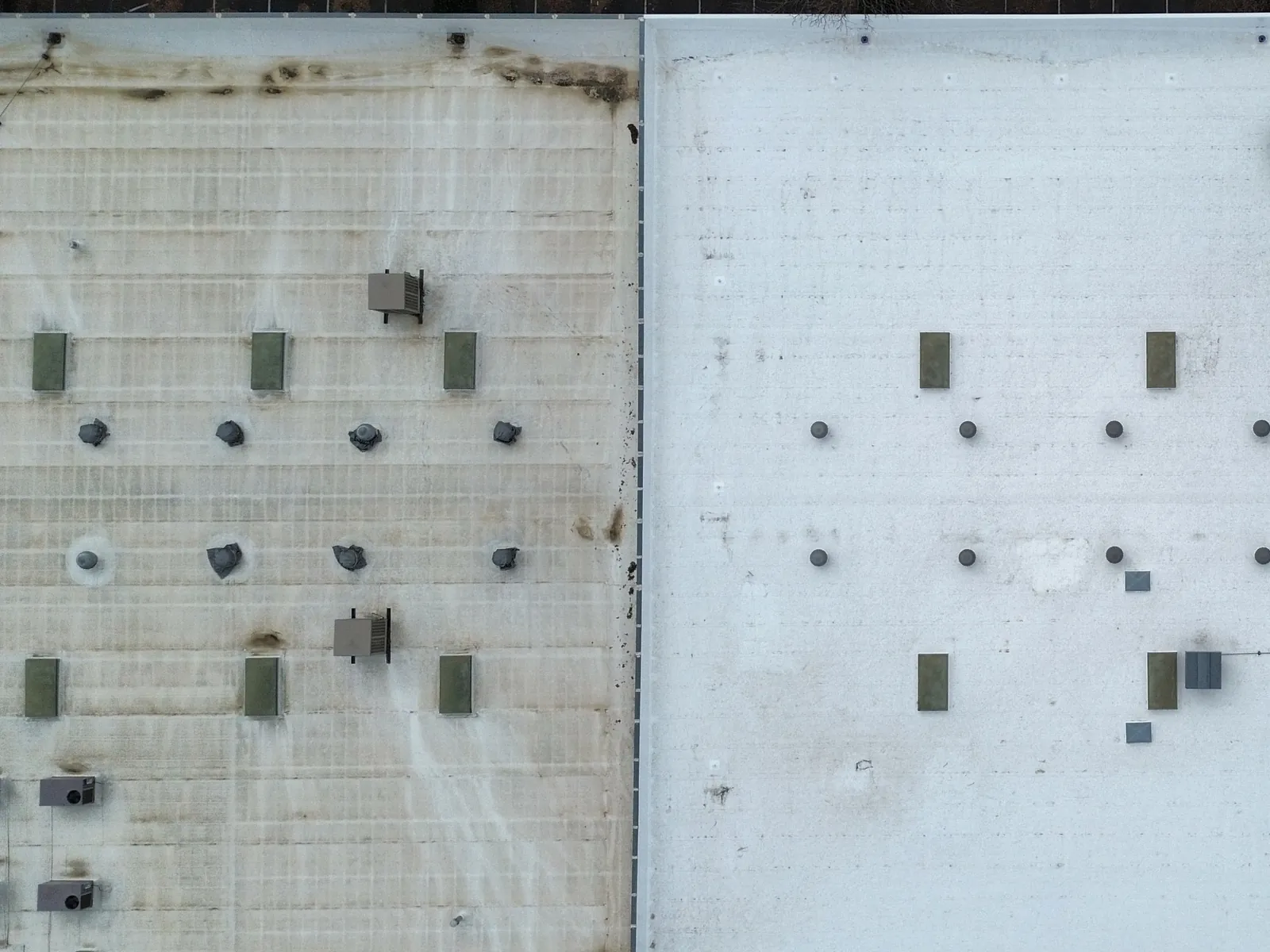 Aerial view of two adjoining commercial flat roofs — one neglected and stained, one maintained and clean