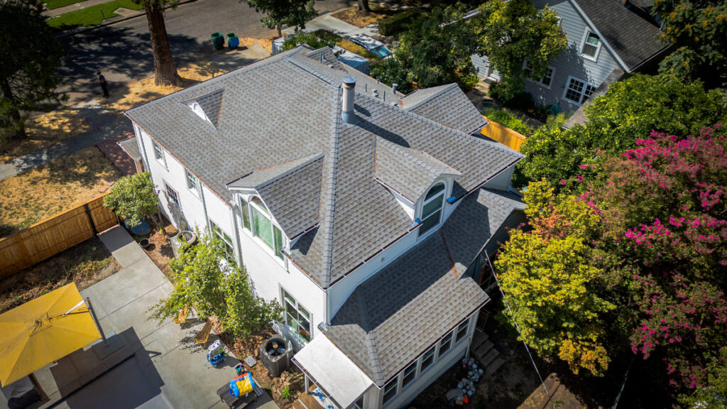 Aerial photo of new asphalt roof installation by butte roofing company in northern california
