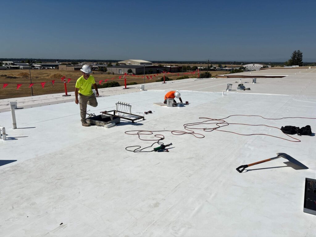 Flat-roof-tpo-commercial Commercial flat roof being installed by butte roofing company in chico, CA